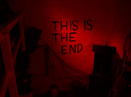 this is a red aesthetic image of a wall with the words "this is the end" written on it